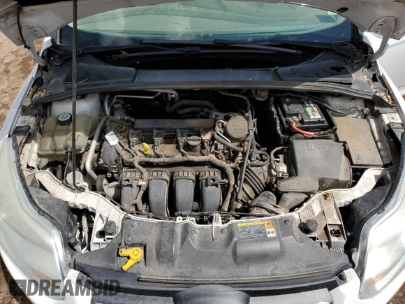 2012 Ford Focus SE z VIN 1FAHP3K29CL279682, wystawiony jako Copart lot #58577755 z przebiegiem 166 768 mil mil oraz Tytuł czysty. Historia ofert i sprzedaży dostępna na DreamBid. Obrazek 11.