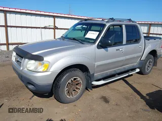 2003 Ford Explorer Sport Trac XLS z VIN 1FMZU77E63UA25807, wystawiony jako IAAI lot #42104625 z przebiegiem 230 608 mil mil oraz . Historia ofert i sprzedaży dostępna na DreamBid. Obrazek 2.