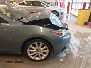 2014 Mazda 3 S Grand Touring with VIN JM1BM1W31E1182703, listed as a IAAI auction lot 41470742 with 123,956 mi miles and . Bid and sale history available at DreamBid. Image 17.
