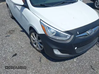2014 Hyundai Accent GLS with VIN KMHCU4AE8EU589409, listed as a IAAI auction lot 42171087 with 209,204 mi miles. Bid and sale history available at carsss.com. Image 6.