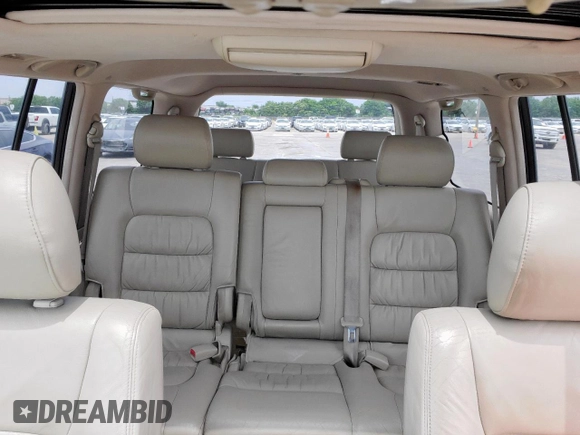 2004 Lexus LX 470 z VIN JTJHT00W743542910, wystawiony jako Copart lot #57187445 z przebiegiem 236 985 mil mil oraz Szkoda całkowita • Salvage title. Historia ofert i sprzedaży dostępna na DreamBid. Obrazek 10.