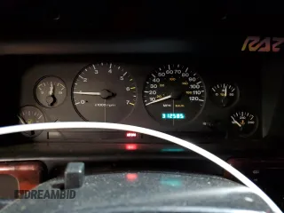 1997 Jeep Grand Cherokee Laredo with VIN 1J4GZ58Y7VC678708, listed as a Copart auction lot 87803725 with 312,585 mi miles and Salvage Title. Bid and sale history available at carsss.com. Image 9.