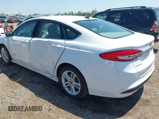 2018 Ford Fusion SE z VIN 3FA6P0LU2JR261268, wystawiony jako IAAI lot #42301578 z przebiegiem 63 357 mil mil oraz . Historia ofert i sprzedaży dostępna na DreamBid. Obrazek 3.