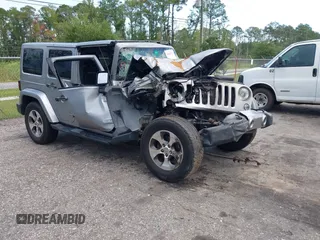 2016 Jeep Wrangler Unlimited Sahara with VIN 1C4BJWEG3GL240859, listed as a IAAI auction lot 42628937 with 103,378 mi miles and . Bid and sale history available at DreamBid. Image 1.