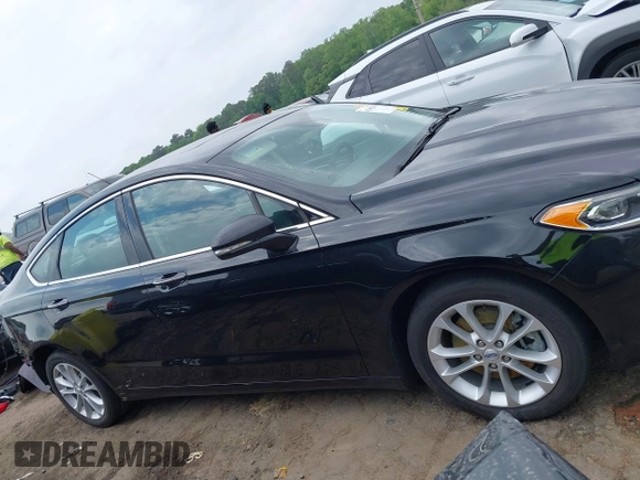 2019 Ford Fusion Titanium with VIN 3FA6P0SU1KR285161, listed as a IAAI auction lot 42092870 with 62,437 mi miles and . Bid and sale history available at DreamBid. Image 14.