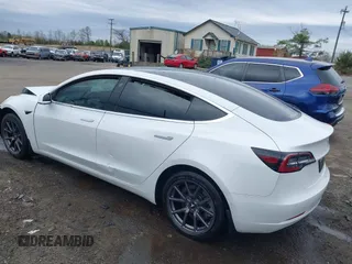 2019 Tesla Model 3 Mid Range with VIN 5YJ3E1EA5KF397098, listed as a IAAI auction lot 41943570 with 72,046 mi miles and . Bid and sale history available at DreamBid. Image 3.