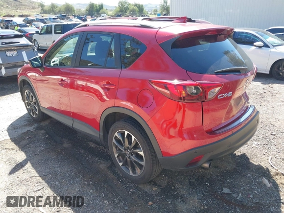 2016 Mazda CX-5 Grand Touring with VIN JM3KE2DY3G0686588, listed as a IAAI auction lot 41697312 with 65,090 mi miles. Bid and sale history available at carsss.com. Image 3.