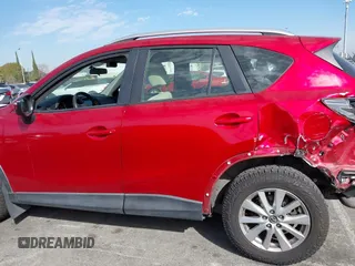 2016 Mazda CX-5 Sport with VIN JM3KE2BY4G0701442, listed as a IAAI auction lot 41682335 with 125,624 mi miles. Bid and sale history available at carsss.com. Image 15.