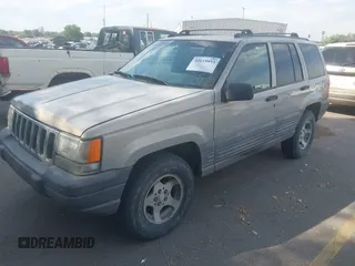 1998 Jeep Grand Cherokee Laredo with VIN 1J4GZ58S6WC319265, listed as a IAAI auction lot 42619853 with 238,667 mi miles and . Bid and sale history available at DreamBid. Image 2.