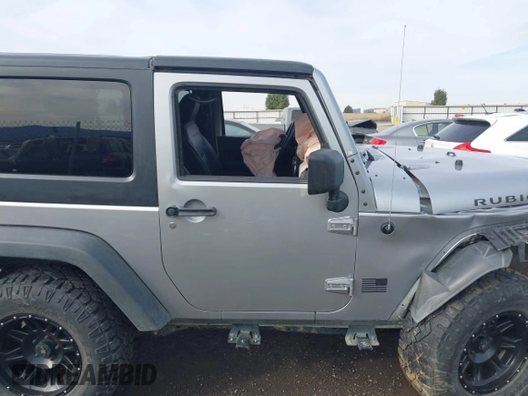 2013 Jeep Wrangler Rubicon 10th Anniversary with VIN 1C4BJWCG8DL639121, listed as a IAAI auction lot 40561773 with 56,023 mi miles and . Bid and sale history available at DreamBid. Image 13.