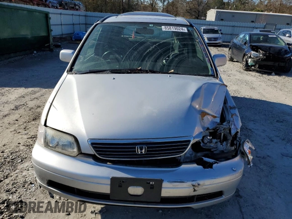 1997 Honda Odyssey with VIN RA11239041, listed as a Copart auction lot 85819024 with 79,952 mi miles and Salvage title. Bid and sale history available at DreamBid. Image 5.