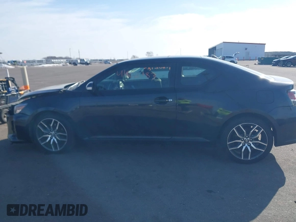 2015 Scion tC with VIN JTKJF5C71F3090963, listed as a IAAI auction lot 41802183 with 107,650 mi miles. Bid and sale history available at carsss.com. Image 14.