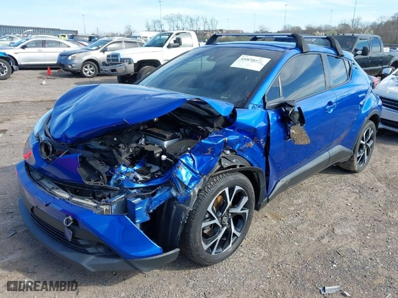 2019 Toyota C-HR XLE with VIN NMTKHMBX2KR091404, listed as a IAAI auction lot 41825675 with 64,255 mi miles. Bid and sale history available at carsss.com. Image 6.
