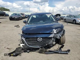 2018 Mazda 3 Touring z VIN 3MZBN1V31JM168860, wystawiony jako Copart lot #61908745 z przebiegiem Nie podano mil oraz Szkoda całkowita • Salvage title. Historia ofert i sprzedaży dostępna na DreamBid. Obrazek 5.