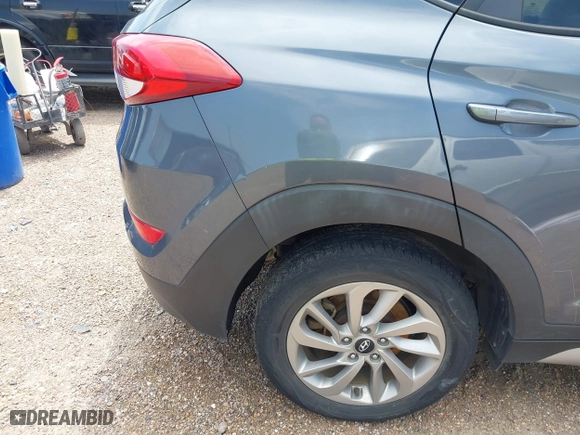 2017 Hyundai Tucson SE Plus with VIN KM8J33A42HU375273, listed as a IAAI auction lot 41900474 with 124,658 mi miles. Bid and sale history available at carsss.com. Image 6.