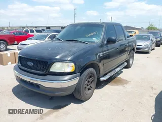 2002 Ford F-150 XLT with VIN 1FTRW07602KD37873, listed as a IAAI auction lot 42048067 with 1 mi miles. Bid and sale history available at carsss.com. Image 2.