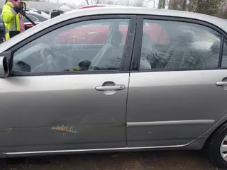 2003 Toyota Corolla CE with VIN JTDBR32E732016827, listed as a IAAI auction lot 41545055 with 140,845 mi miles. Bid and sale history available at carsss.com. Image 14.