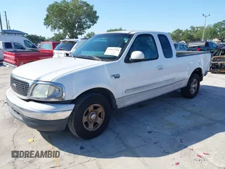 2002 Ford F-150 XL with VIN 1FTRX17WX2NA92467, listed as a IAAI auction lot 41977334 with 176,902 mi miles. Bid and sale history available at carsss.com. Image 2.