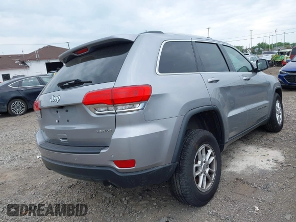 2018 Jeep Grand Cherokee Laredo E with VIN 1C4RJFAG5JC377197, listed as a IAAI auction lot 42432131 with 58,981 mi miles and . Bid and sale history available at DreamBid. Image 4.