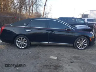 2013 Cadillac XTS Premium z VIN 2G61S5S38D9199459, wystawiony jako IAAI lot #41787638 z przebiegiem 171 298 mil mil oraz . Historia ofert i sprzedaży dostępna na DreamBid. Obrazek 13.