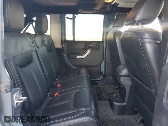 2014 Jeep Wrangler Unlimited Rubicon with VIN 1C4HJWFG9EL199501, listed as a Copart auction lot 61443595 with 86,940 mi miles and Salvage title. Bid and sale history available at DreamBid. Image 10.