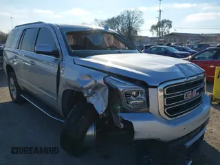 2020 GMC Yukon SLT Standard Edition with VIN 1GKS2DKCXLR294027, listed as a IAAI auction lot 41004965 with 69,161 mi miles. Bid and sale history available at carsss.com. Image 1.