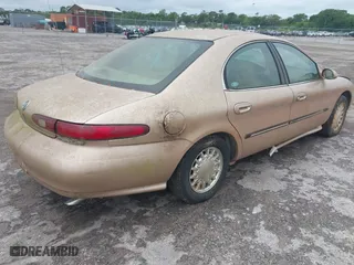 1996 Mercury Sable LS with VIN 1MELM53S6TA606332, listed as a IAAI auction lot 41984196 with 150,924 mi miles. Bid and sale history available at carsss.com. Image 4.