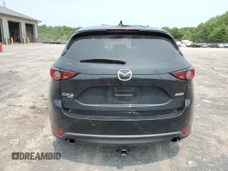 2019 Mazda CX-5 Grand Touring with VIN JM3KFBDM2K0569829, listed as a Copart auction lot 59060965 with 99,359 mi miles and Salvage title. Bid and sale history available at DreamBid. Image 6.