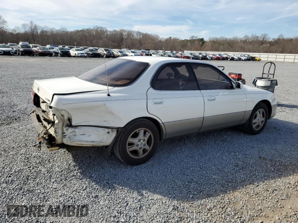 1995 Lexus ES 300 with VIN JT8GK13T8S0107061, listed as a Copart auction lot 49986875 with 306,343 mi miles and Salvage Title. Bid and sale history available at DreamBid. Image 3.