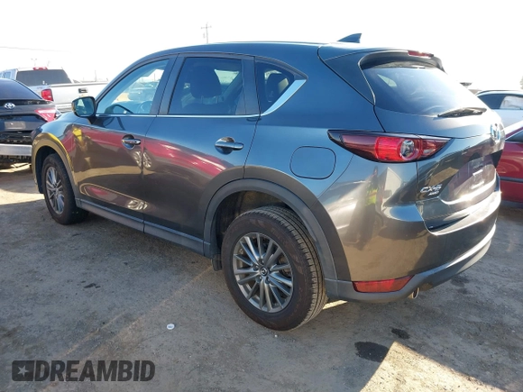 2017 Mazda CX-5 Touring with VIN JM3KFBCL2H0165625, listed as a IAAI auction lot 41879145 with 64,745 mi miles. Bid and sale history available at carsss.com. Image 3.