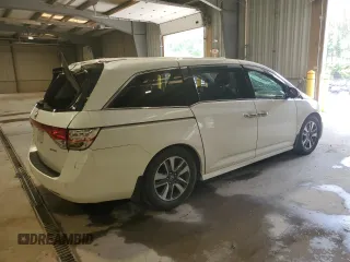 2016 Honda Odyssey Touring Elite with VIN 5FNRL5H91GB070424, listed as a Copart auction lot 55583075 with 115,709 mi miles and Salvage Title. Bid and sale history available at DreamBid. Image 3.