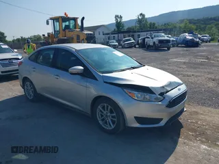 2015 Ford Focus SE z VIN 1FADP3F20FL292897, wystawiony jako IAAI lot #42763077 z przebiegiem 107 087 mil mil oraz . Historia ofert i sprzedaży dostępna na DreamBid. Obrazek 1.
