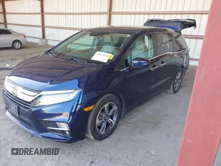2020 Honda Odyssey Touring with VIN 5FNRL6H82LB015715, listed as a IAAI auction lot 41915849 with 69,603 mi miles and . Bid and sale history available at DreamBid. Image 2.
