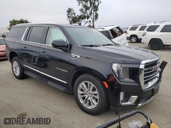 2023 GMC Yukon XL SLT with VIN 1GKS2GKD5PR363433, listed as a Copart auction lot 85979734 with 61,957 mi miles and Salvage Title. Bid and sale history available at DreamBid. Image 4.