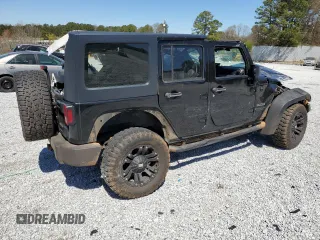 2014 Jeep Wrangler Unlimited Sport with VIN 1C4BJWDG7EL257811, listed as a Copart auction lot 50112335 with 218,530 mi miles and Salvage Title. Bid and sale history available at carsss.com. Image 3.
