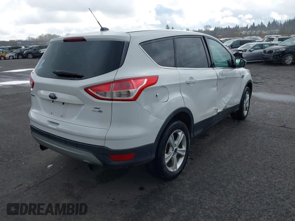 2013 Ford Escape SE with VIN 1FMCU9G93DUA17816, listed as a IAAI auction lot 41688140 with 129,738 mi miles. Bid and sale history available at carsss.com. Image 4.