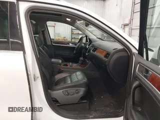 2013 Volkswagen Touareg Lux with VIN WVGEF9BP5DD011511, listed as a IAAI auction lot 41608840 with 167,350 mi miles and . Bid and sale history available at DreamBid. Image 5.