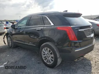 2017 Cadillac XT5 FWD with VIN 1GYKNARS0HZ283618, listed as a Copart auction lot 61640005 with 113,823 mi miles and Salvage title. Bid and sale history available at DreamBid. Image 2.