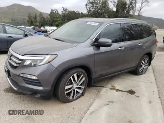 2017 Honda Pilot Touring with VIN 5FNYF5H91HB011586, listed as a Copart auction lot 58086595 with 74,713 mi miles and Salvage title. Bid and sale history available at DreamBid. Image 1.