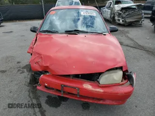 1995 Ford Aspire z VIN KNJLT05H6S6138271, wystawiony jako Copart lot #47638565 z przebiegiem 163 212 mil mil oraz Szkody całkowita. Historia ofert i sprzedaży dostępna na DreamBid. Obrazek 5.