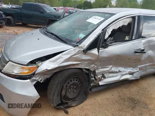 2013 Honda Odyssey LX with VIN 5FNRL5H27DB075559, listed as a IAAI auction lot 42007141 with Not Provided miles and . Bid and sale history available at carsss.com. Image 6.