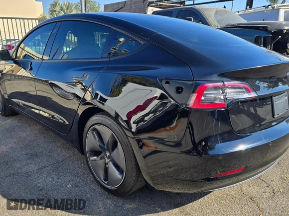 2021 Tesla Model 3 Standard Range Plus with VIN 5YJ3E1EA1MF871146, listed as a Copart auction lot 55633575 with 72,492 mi miles and Salvage Title. Bid and sale history available at DreamBid. Image 3.