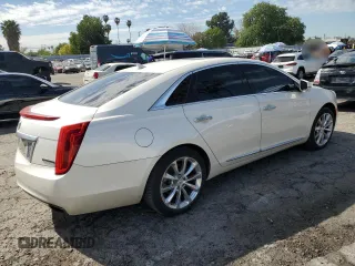 2014 Cadillac XTS Premium with VIN 2G61P5S36E9305491, listed as a Copart auction lot 44404425 with 104,710 mi miles and Salvage Title. Bid and sale history available at DreamBid. Image 3.