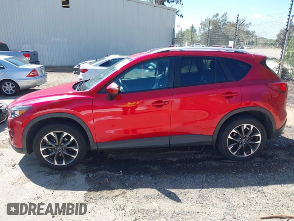 2016 Mazda CX-5 Grand Touring with VIN JM3KE2DY3G0686588, listed as a IAAI auction lot 41697312 with 65,090 mi miles. Bid and sale history available at carsss.com. Image 14.