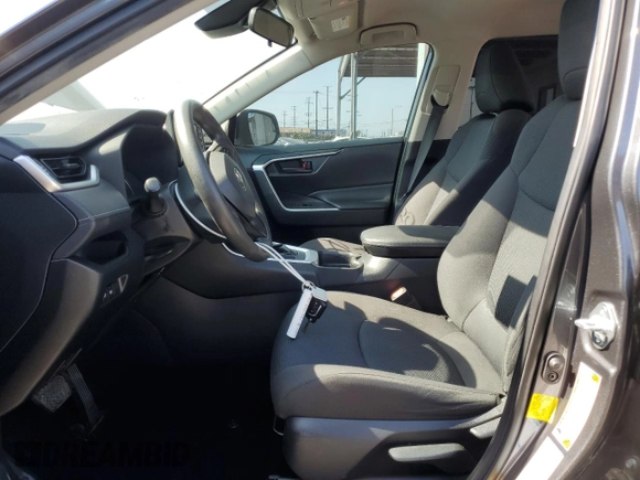 2019 Toyota RAV4 LE with VIN JTMF1RFV6KD503302, listed as a Copart auction lot 62384955 with 77,703 mi miles and Salvage title. Bid and sale history available at DreamBid. Image 7.