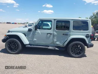2023 Jeep Wrangler Sahara with VIN 1C4JJXP68PW627007, listed as a IAAI auction lot 42474745 with 57,912 mi miles and . Bid and sale history available at DreamBid. Image 14.
