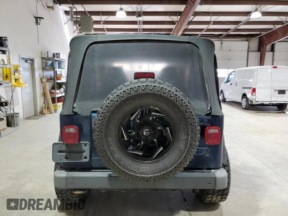 2002 Jeep Wrangler Sport with VIN 1J4FA49S82P703420, listed as a Copart auction lot 53322175 with 87,642 mi miles and Salvage Title. Bid and sale history available at carsss.com. Image 6.