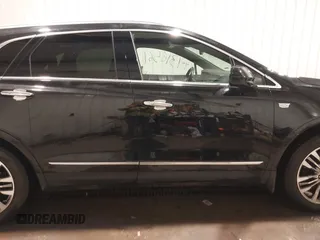 2019 Cadillac XT5 Premium Luxury AWD z VIN 1GYKNFRSXKZ189590, wystawiony jako IAAI lot #41316561 z przebiegiem 98 755 mil mil oraz . Historia ofert i sprzedaży dostępna na DreamBid. Obrazek 14.