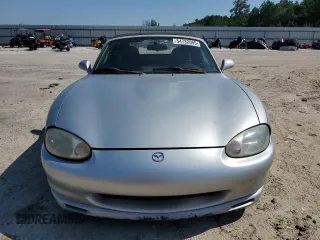 1999 Mazda MX-5 Miata z VIN JM1NB3538X0112611, wystawiony jako Copart lot #54732095 z przebiegiem 173 763 mil mil oraz Szkoda całkowita • Salvage title. Historia ofert i sprzedaży dostępna na DreamBid. Obrazek 5.