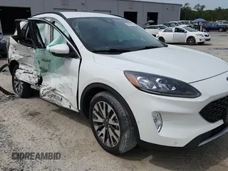 2020 Ford Escape Titanium z VIN 1FMCU9J91LUB53076, wystawiony jako Copart lot #64008765 z przebiegiem Nie podano mil oraz Nie do naprawy • Non repairable. Historia ofert i sprzedaży dostępna na DreamBid. Obrazek 14.